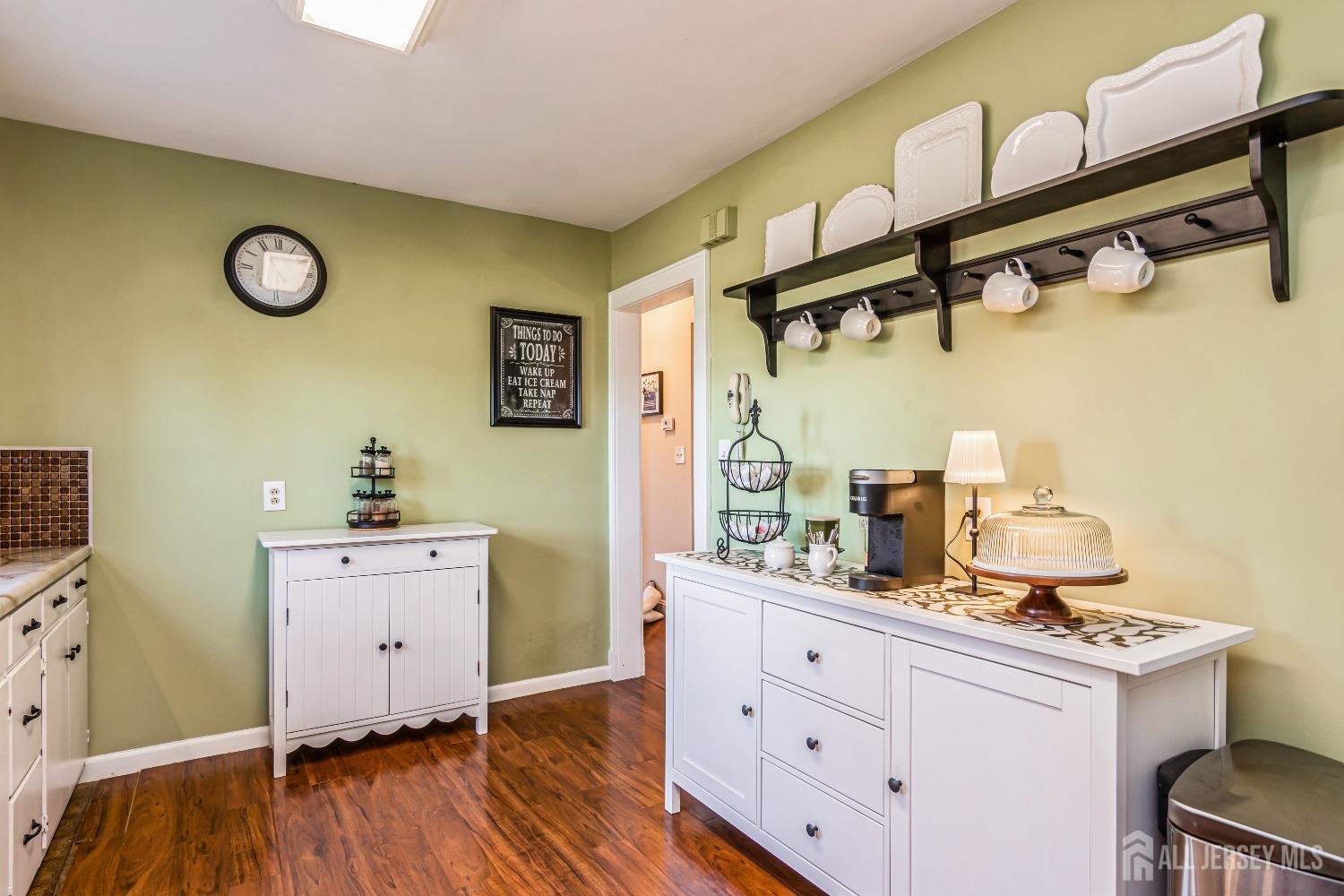 25 Simpson Avenue Edison, NJ 08817 - Photo 8 of 25 a kitchen with cabinets and wooden floor