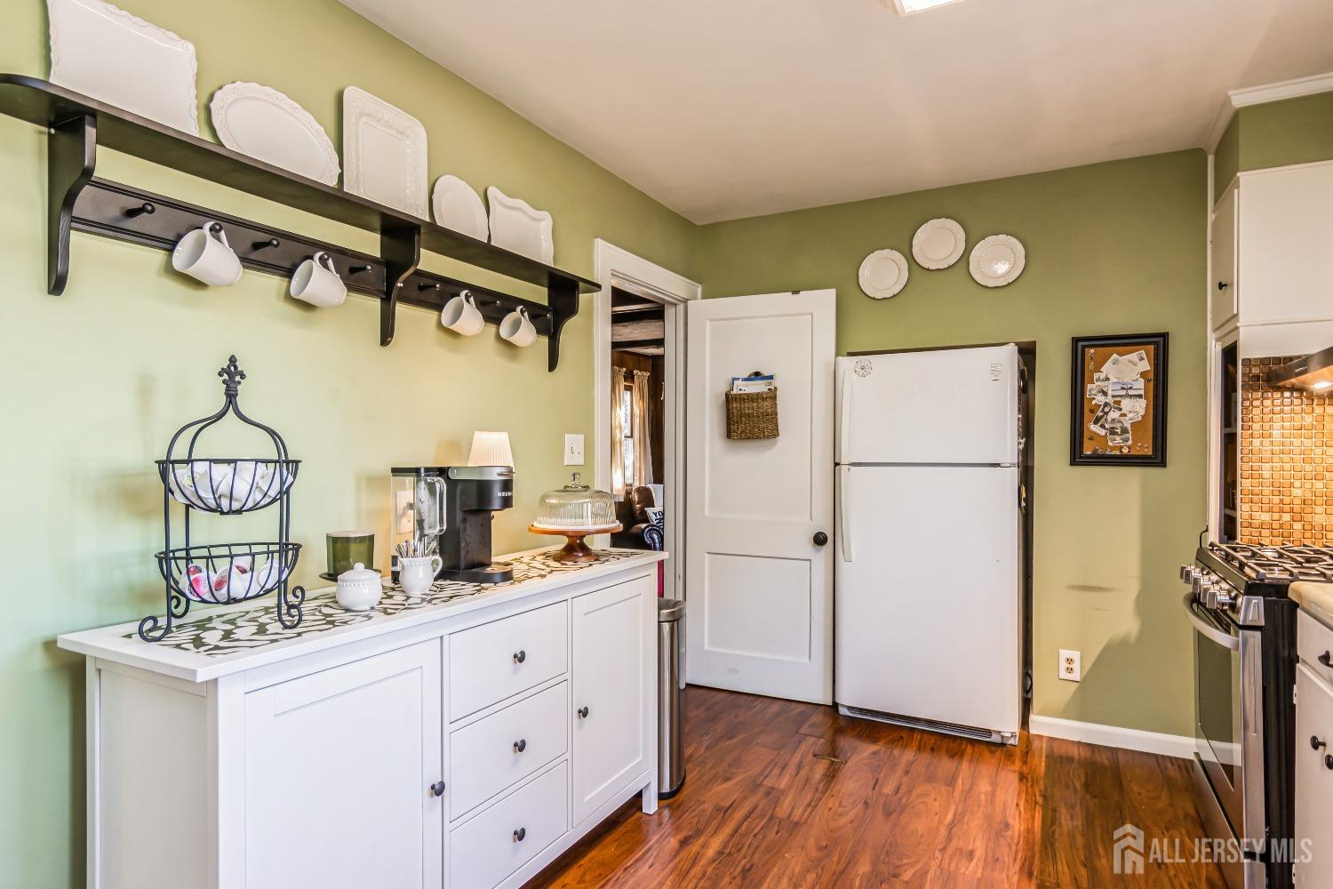 25 Simpson Avenue Edison, NJ 08817 - Photo 10 of 25 a kitchen with cabinets and wooden floor