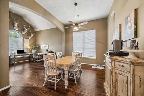 a view of a dining room with furniture window and wooden floor