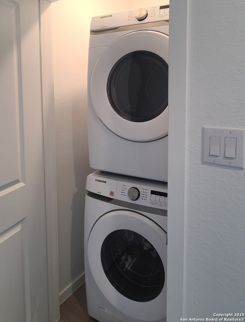 4965 Daisy Blossom Converse, TX 78109 - Photo 12 of 23 a utility room with dryer and washer