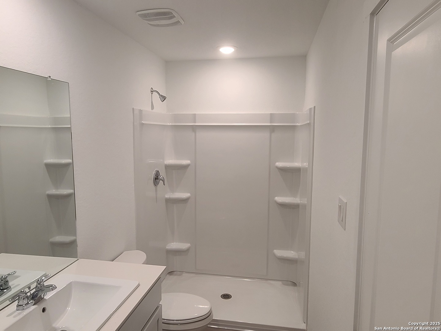 4965 Daisy Blossom Converse, TX 78109 - Photo 15 of 23 a bathroom with a shower a toilet and sink