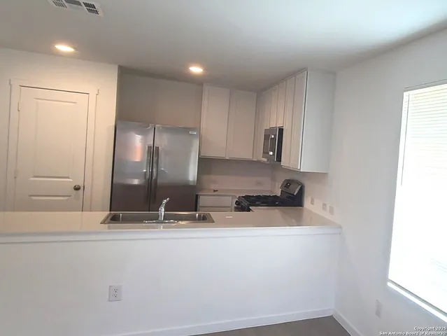 a bathroom with a sink and mirror