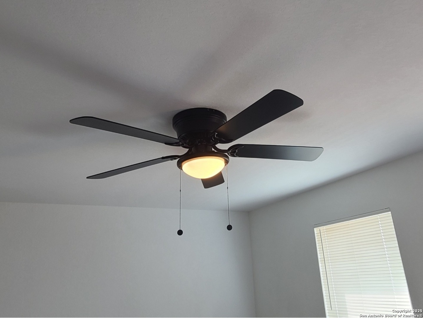 4965 Daisy Blossom Converse, TX 78109 - Photo 8 of 23 a bathroom with a light fixture a sink and a window