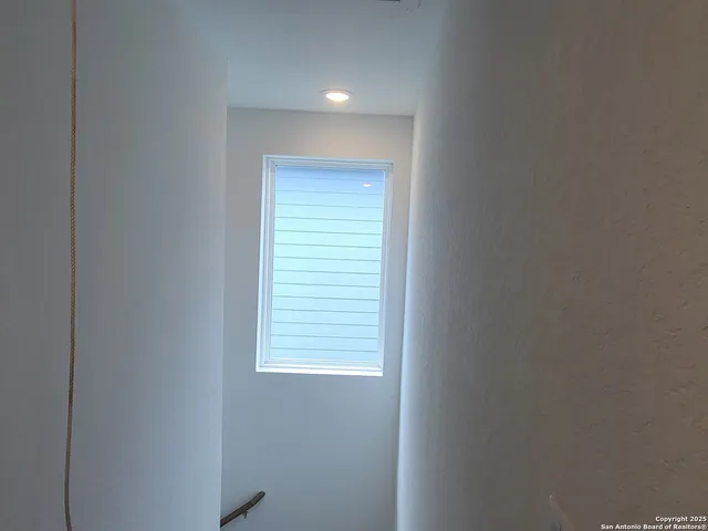 a view of a bathroom from a hallway