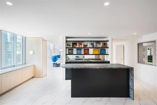 a kitchen with stainless steel appliances granite countertop a stove and a sink