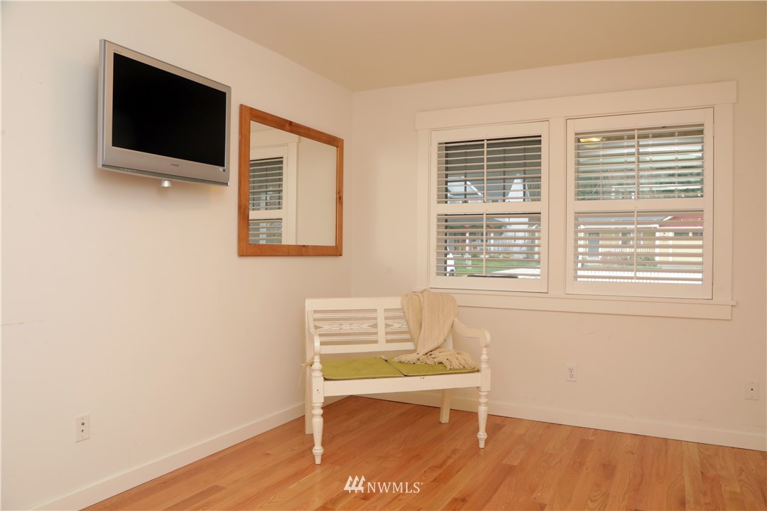 1813 Watkins Road Freeland, WA 98249 - Photo 17 of 29 a view of a livingroom with wooden floor and furniture