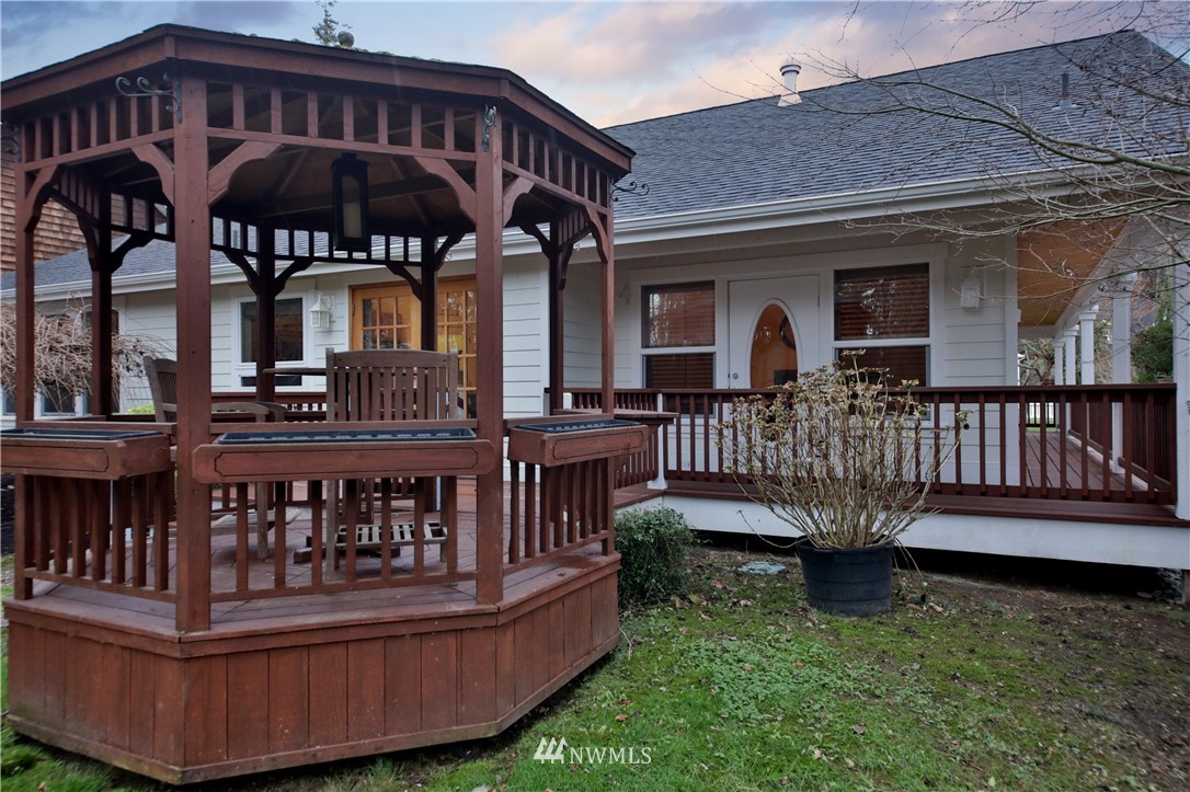 1813 Watkins Road Freeland, WA 98249 - Photo 23 of 29 a view of a house with a wooden deck