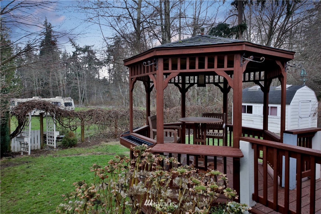 1813 Watkins Road Freeland, WA 98249 - Photo 24 of 29 a view of a wooden house with a yard