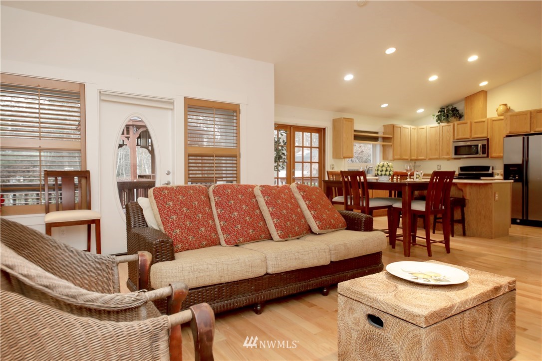 1813 Watkins Road Freeland, WA 98249 - Photo 9 of 29 a living room with furniture and wooden floor