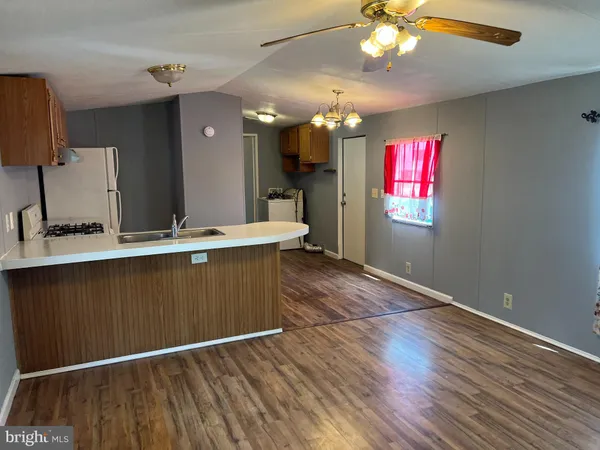 a bathroom with a toilet and bathtub