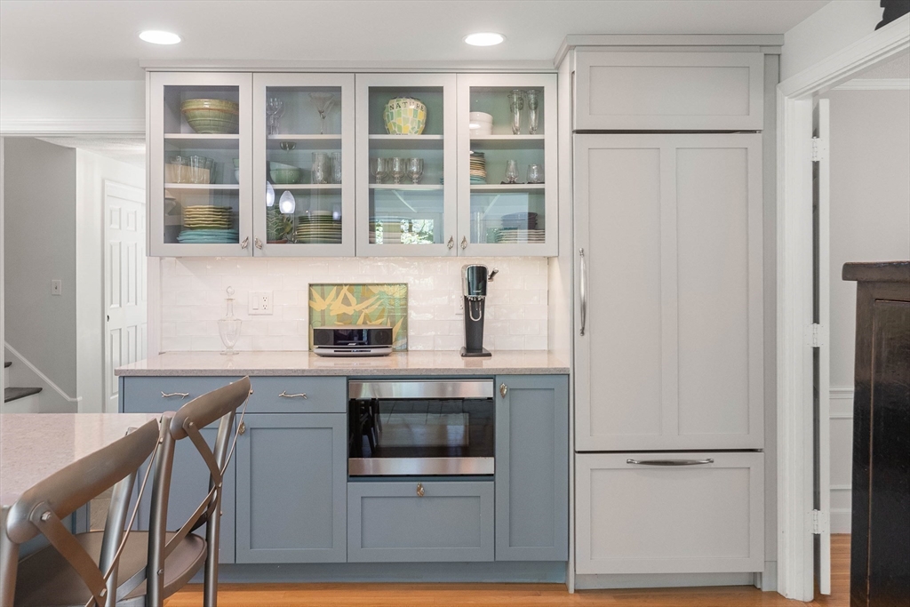 73 High Ridge Road Boxford, MA 01921 - Photo 11 of 39 a kitchen with stainless steel appliances granite countertop a refrigerator and a stove top oven