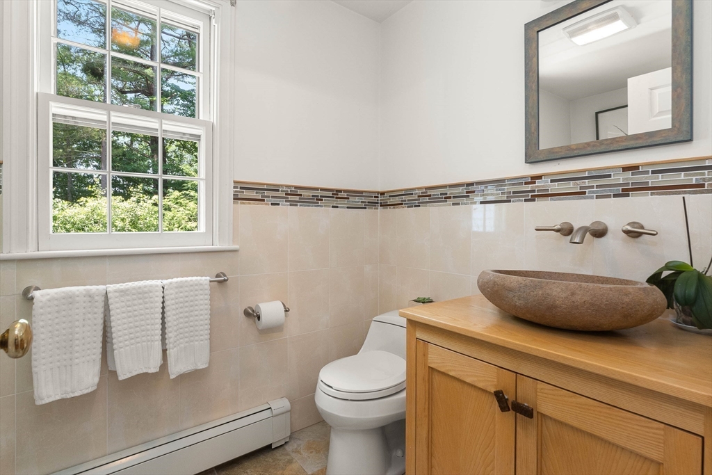 73 High Ridge Road Boxford, MA 01921 - Photo 20 of 39 a bathroom with a toilet sink and mirror