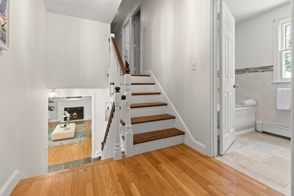 73 High Ridge Road Boxford, MA 01921 - Photo 27 of 39 a view of a livingroom with wooden floor and stairs