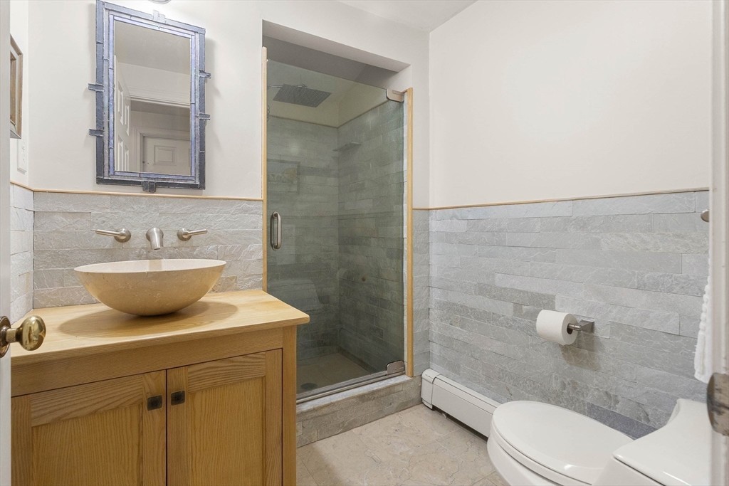 73 High Ridge Road Boxford, MA 01921 - Photo 28 of 39 a bathroom with a sink toilet and shower