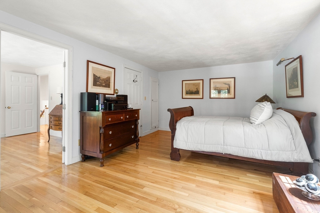 73 High Ridge Road Boxford, MA 01921 - Photo 30 of 39 a bedroom with a bed and a desk