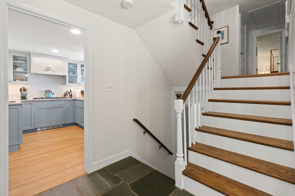 73 High Ridge Road Boxford, MA 01921 - Photo 9 of 39 a view of a hallway to an empty room and wooden floor