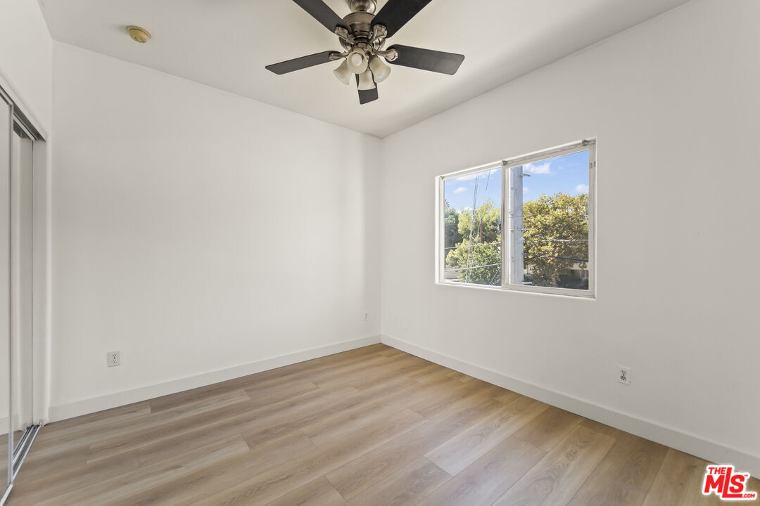 12375 Osborne Place, Unit 13 Pacoima, CA 91331 - Photo 22 of 37 a view of an empty room with a window
