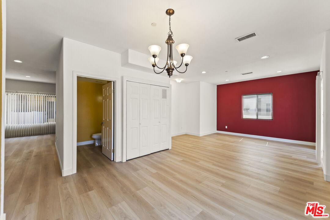12375 Osborne Place, Unit 13 Pacoima, CA 91331 - Photo 3 of 37 a view of a livingroom with a chandelier