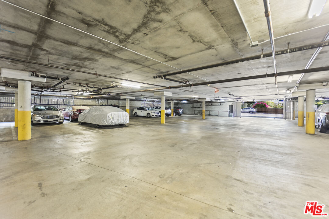 12375 Osborne Place, Unit 13 Pacoima, CA 91331 - Photo 33 of 37 a view of parking garage with cars