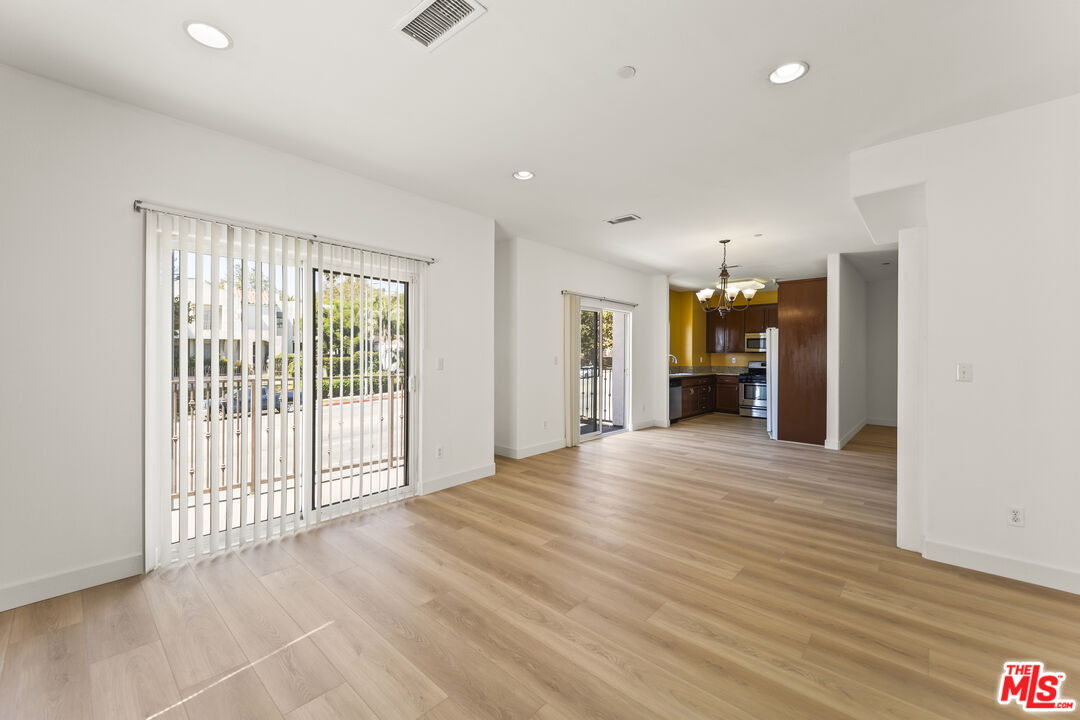 12375 Osborne Place, Unit 13 Pacoima, CA 91331 - Photo 5 of 37 a view of a livingroom with a staircase