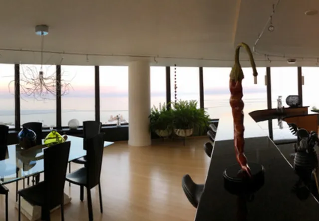 a view of a swimming pool with a yard and sitting area