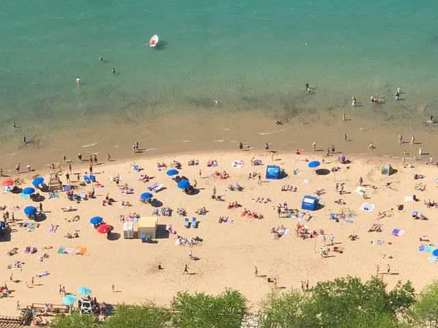 a living room with furniture and large windows
