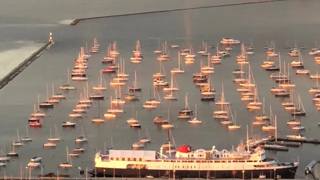 a living room with furniture and floor to ceiling windows