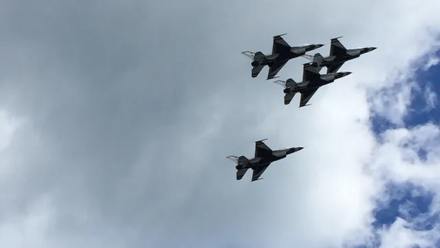 a bedroom with a bed and a mirror