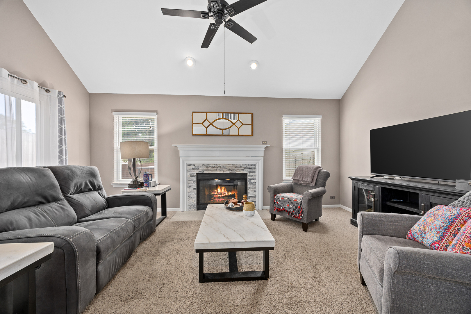 2 Buckboard Court Bolingbrook, IL 60490 - Photo 18 of 33 a living room with furniture and a flat screen tv