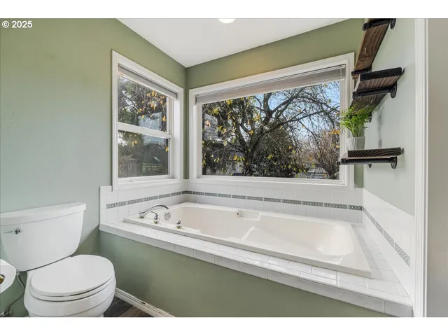 a bathroom with a toilet a sink and a bathtub