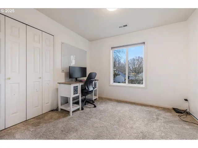 a workspace with furniture and a window