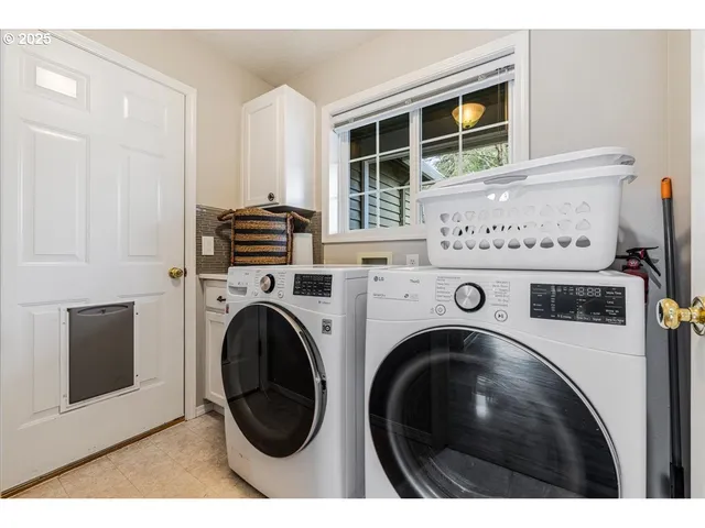 a utility room with dryer and washer