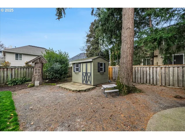a backyard of a house with garden and patio