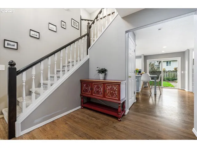 a view of an entryway with wooden floor