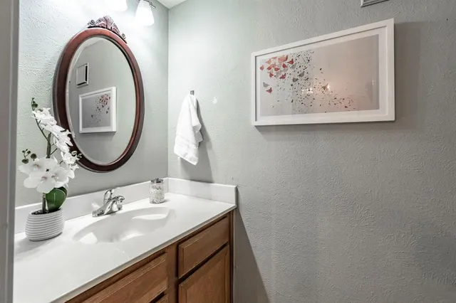 a bathroom with a sink and a mirror