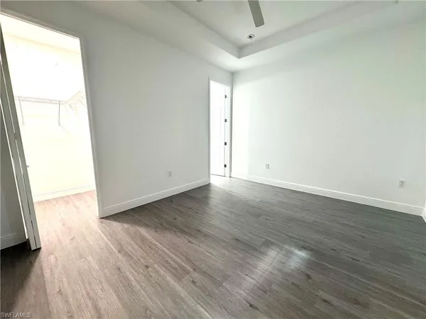 an empty room with wooden floor