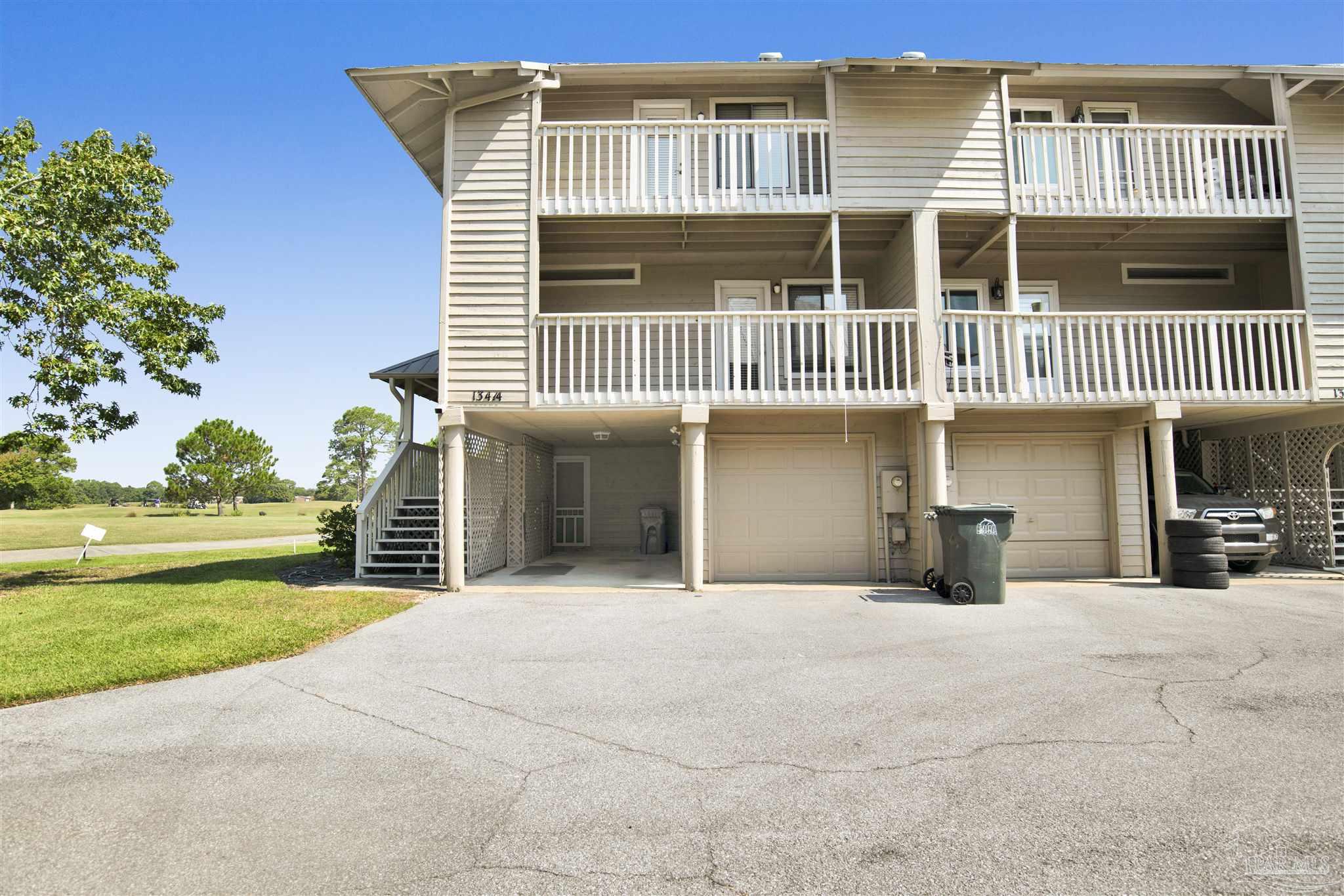 13414 Valerie Drive Pensacola, FL 32507 - Photo 1 of 35 a front view of a house with a yard and garage