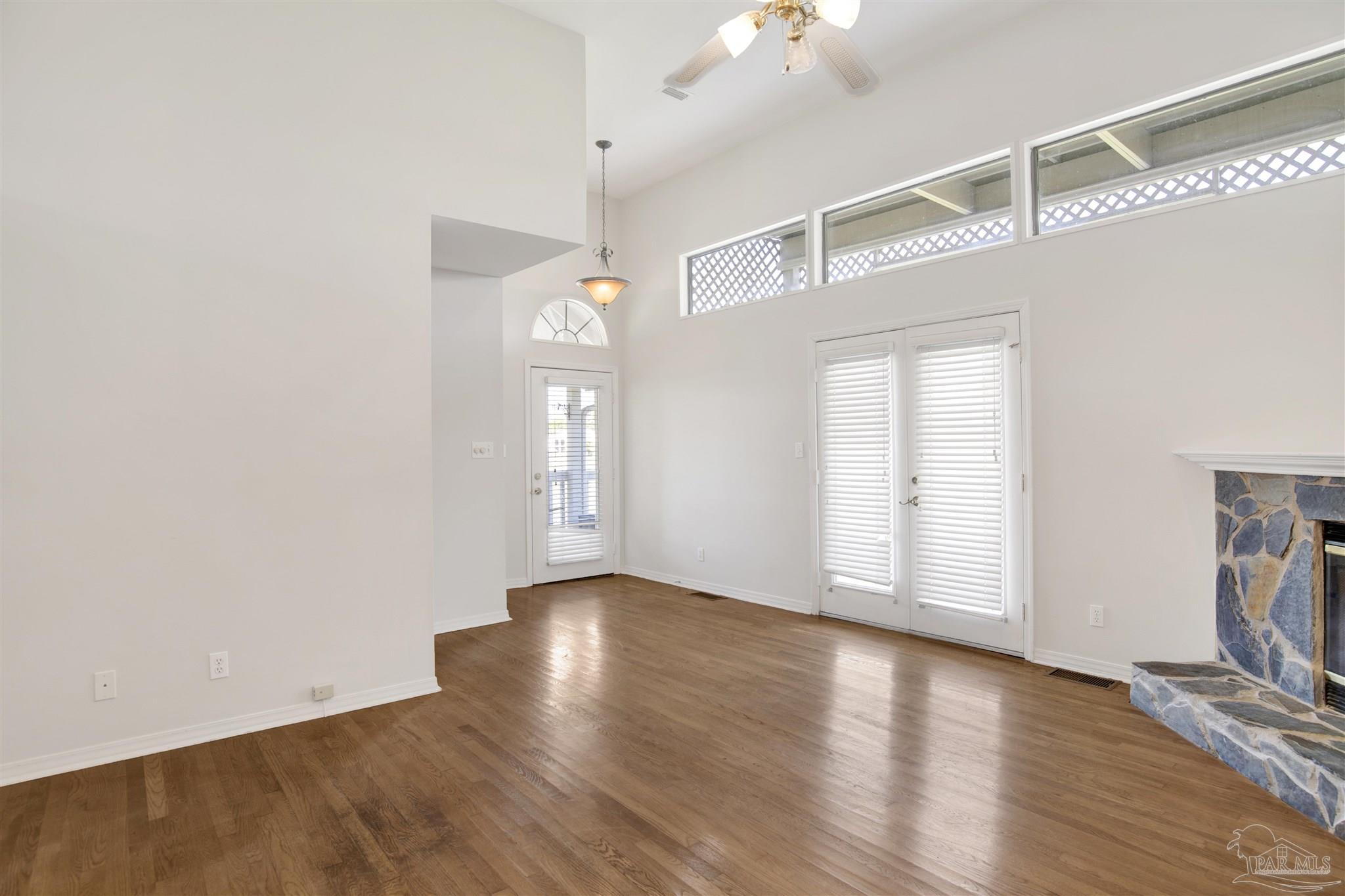 13414 Valerie Drive Pensacola, FL 32507 - Photo 13 of 35 a view of an empty room with wooden floor