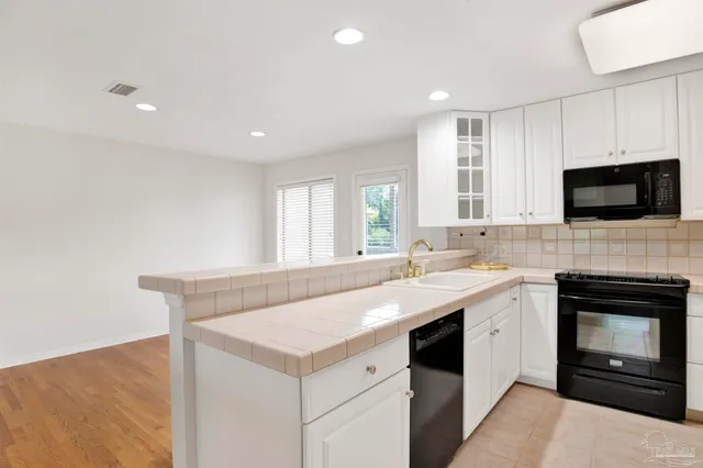 a kitchen with a stove and a sink