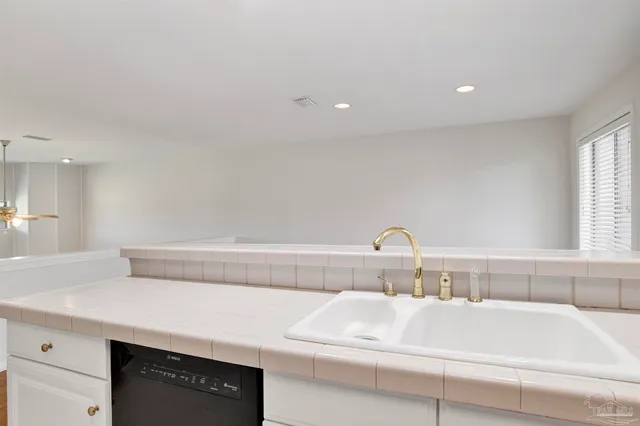 a bathroom with a sink and a window