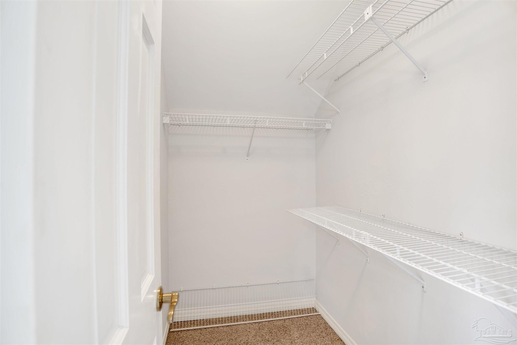 13414 Valerie Drive Pensacola, FL 32507 - Photo 23 of 35 a view of small space with racks on the wall