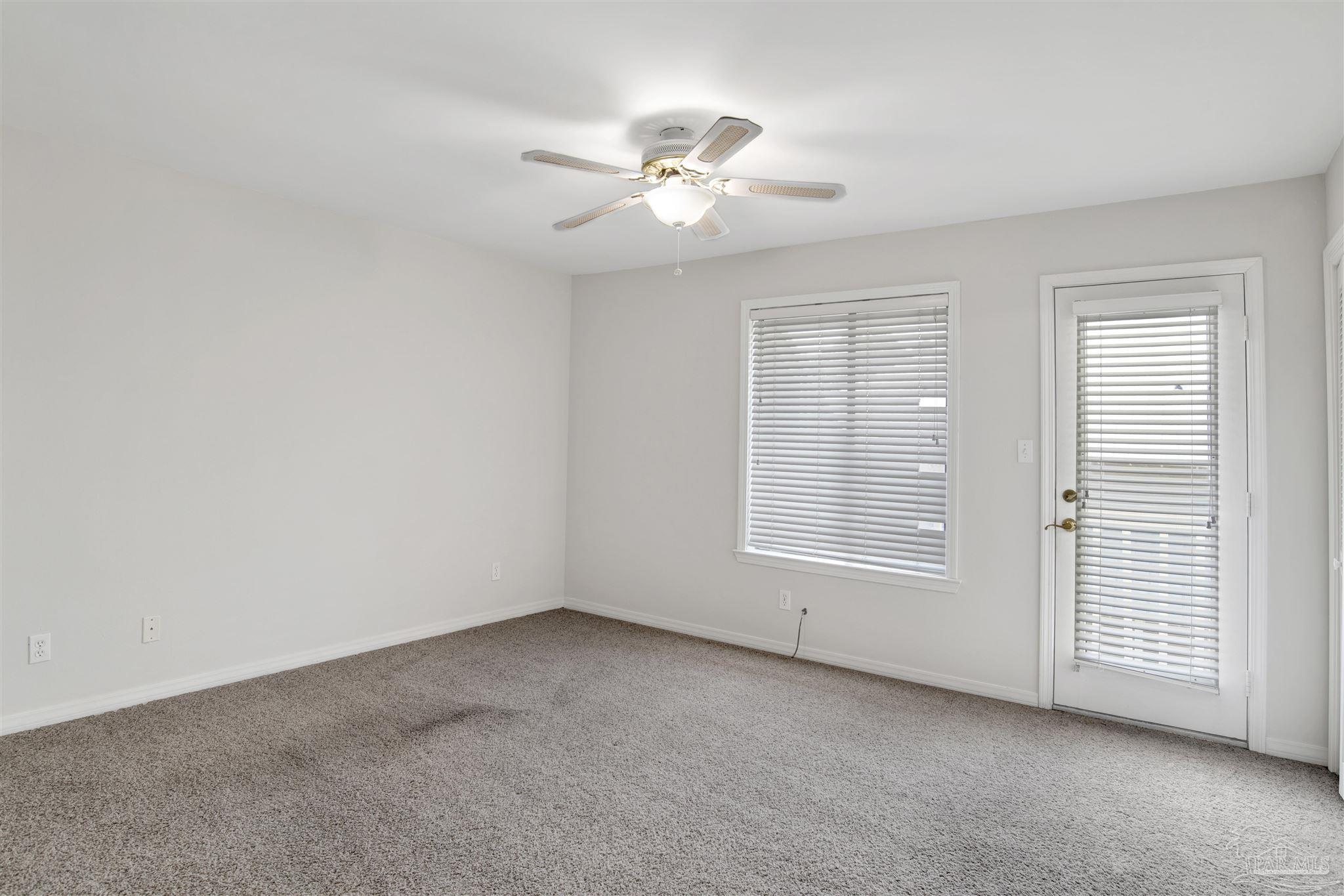 13414 Valerie Drive Pensacola, FL 32507 - Photo 24 of 35 an empty room with a window and a fan