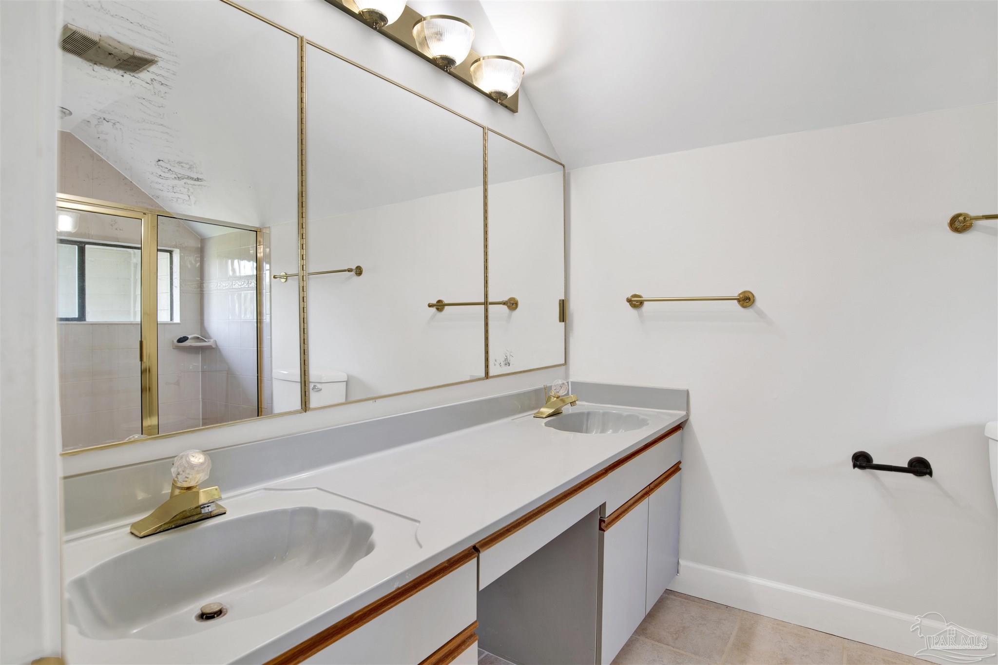 13414 Valerie Drive Pensacola, FL 32507 - Photo 29 of 35 a bathroom with a sink and a mirror