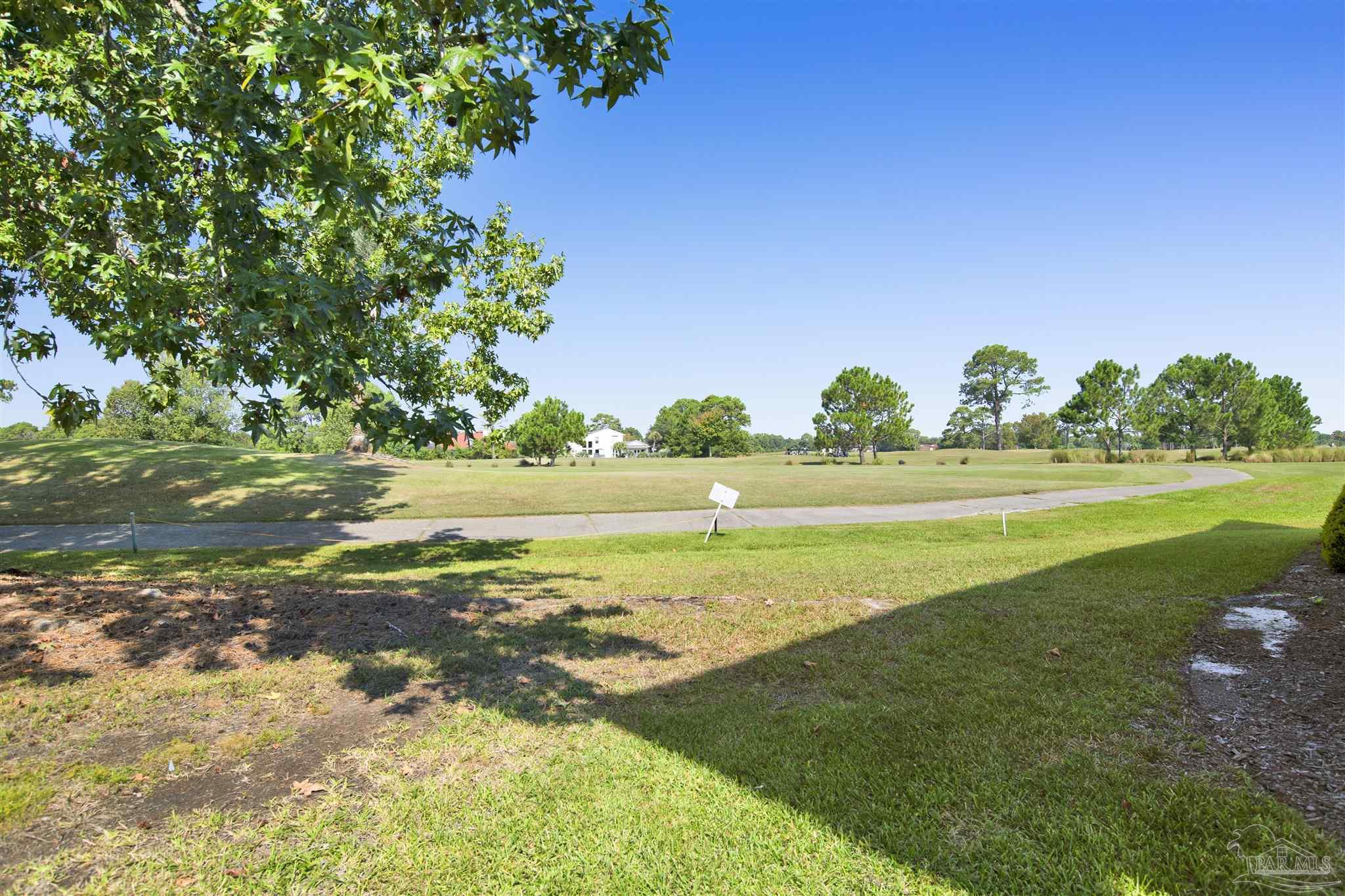 13414 Valerie Drive Pensacola, FL 32507 - Photo 3 of 35 a view of a golf course with a lake
