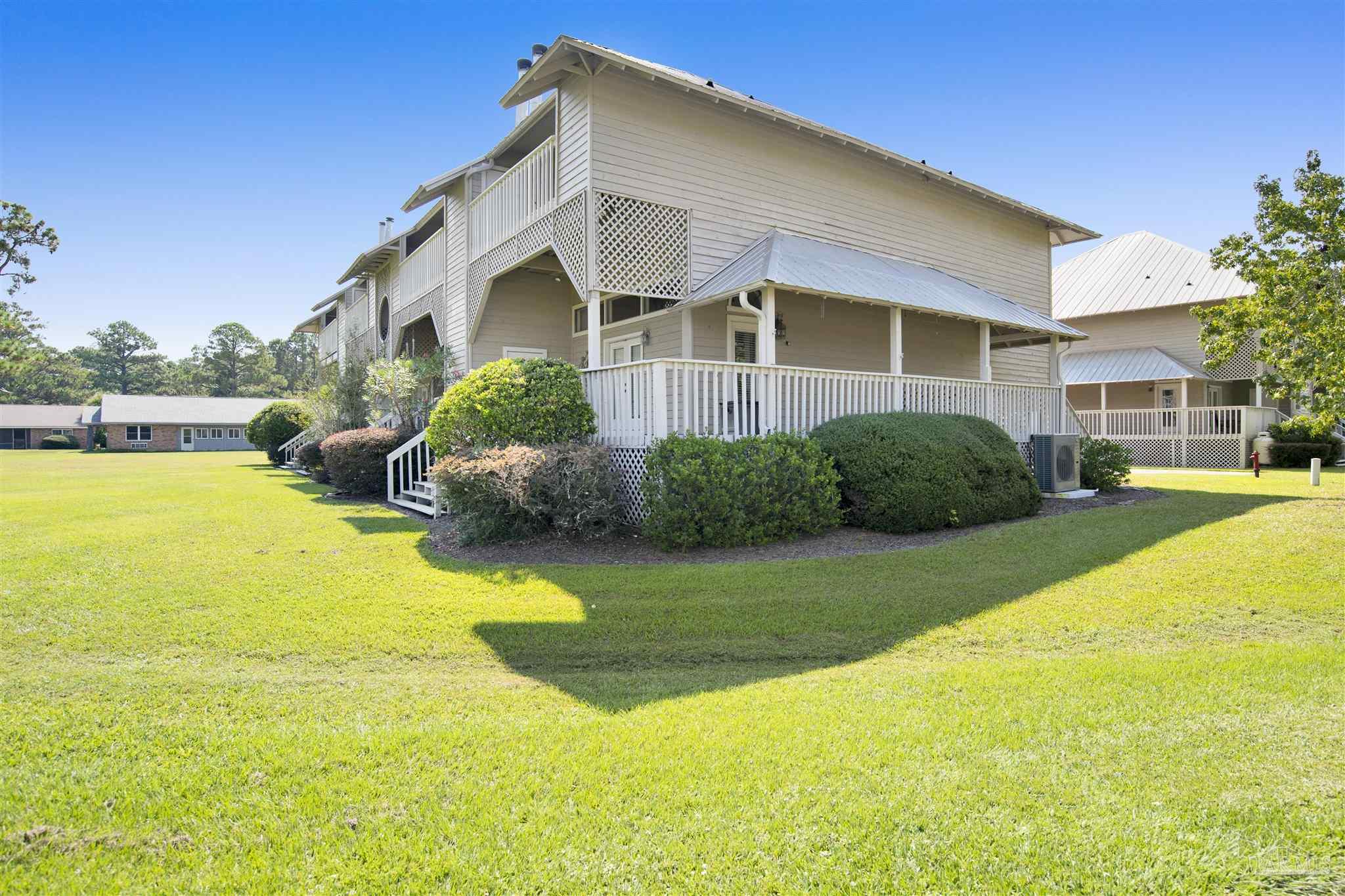 13414 Valerie Drive Pensacola, FL 32507 - Photo 5 of 35 a view of a house with a swimming pool