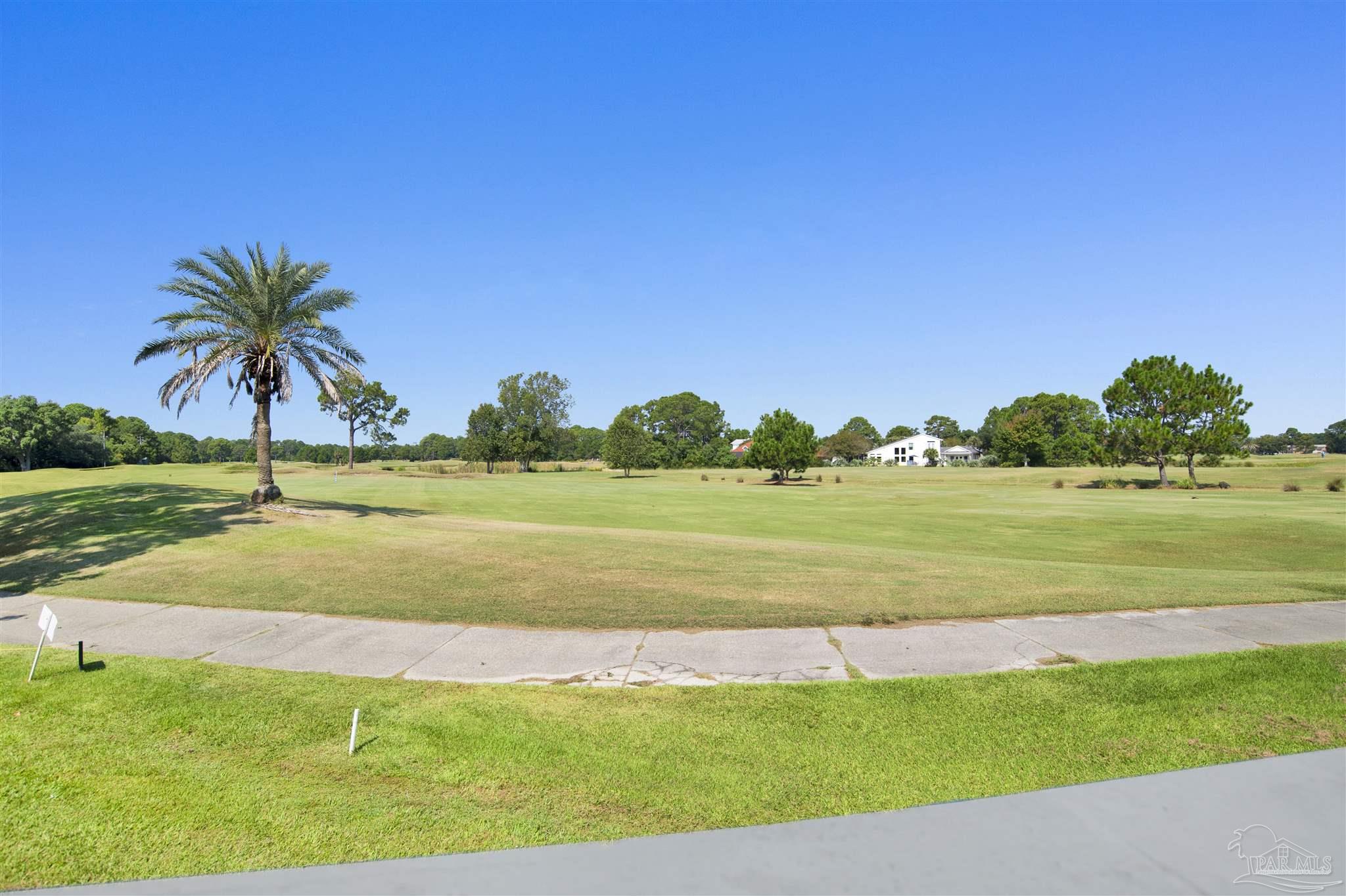 13414 Valerie Drive Pensacola, FL 32507 - Photo 8 of 35 a view of a golf course with a lake
