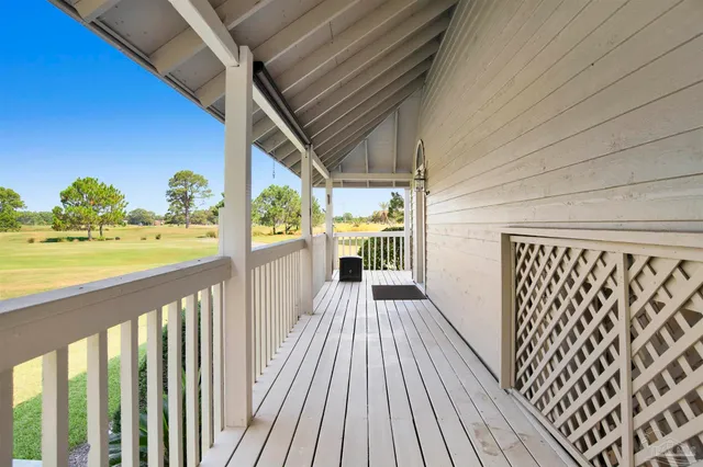 a view of a balcony with wooden floor