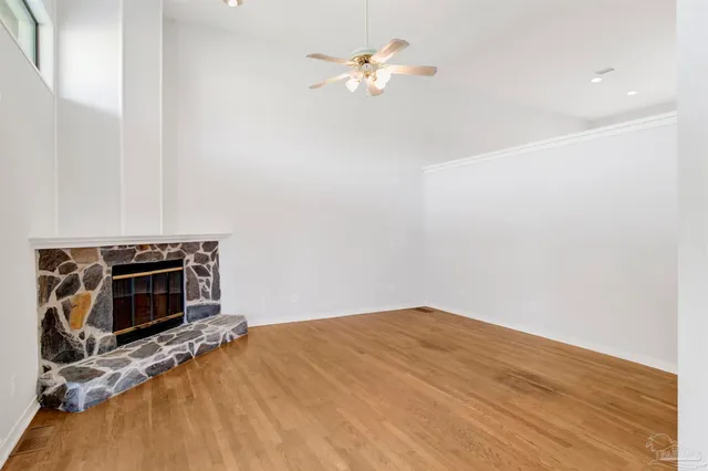 a bedroom with a bed and a fireplace