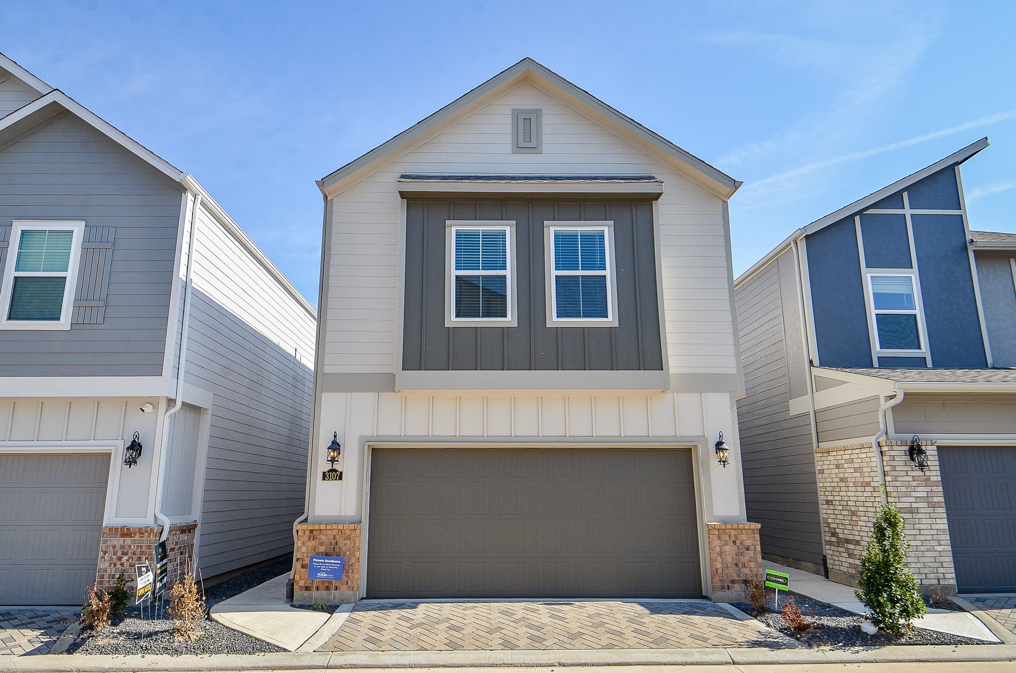 a front view of a house with a garage