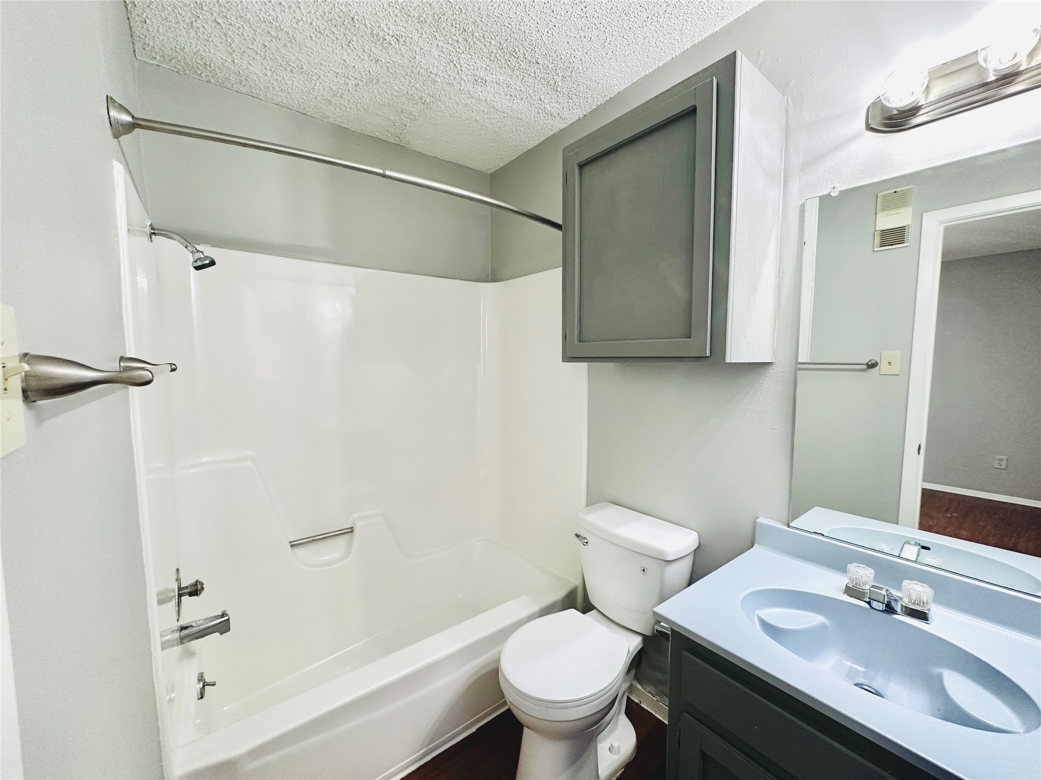 3702 South 2nd Street, Unit 107 Austin, TX 78704 - Photo 11 of 12 a bathroom with a sink toilet and shower